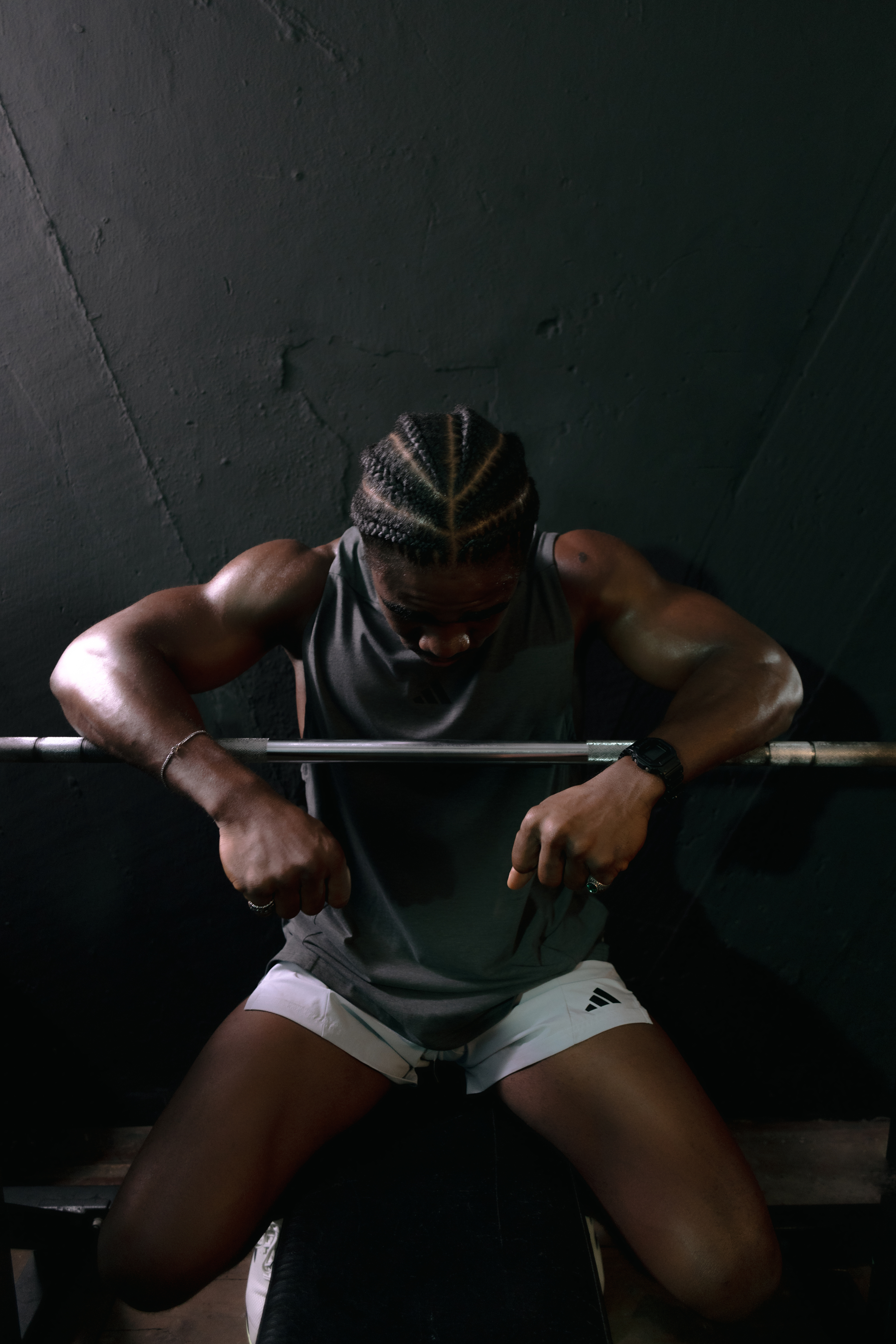 VV Fitness trainer Victor Magnus seated under a barbell after training